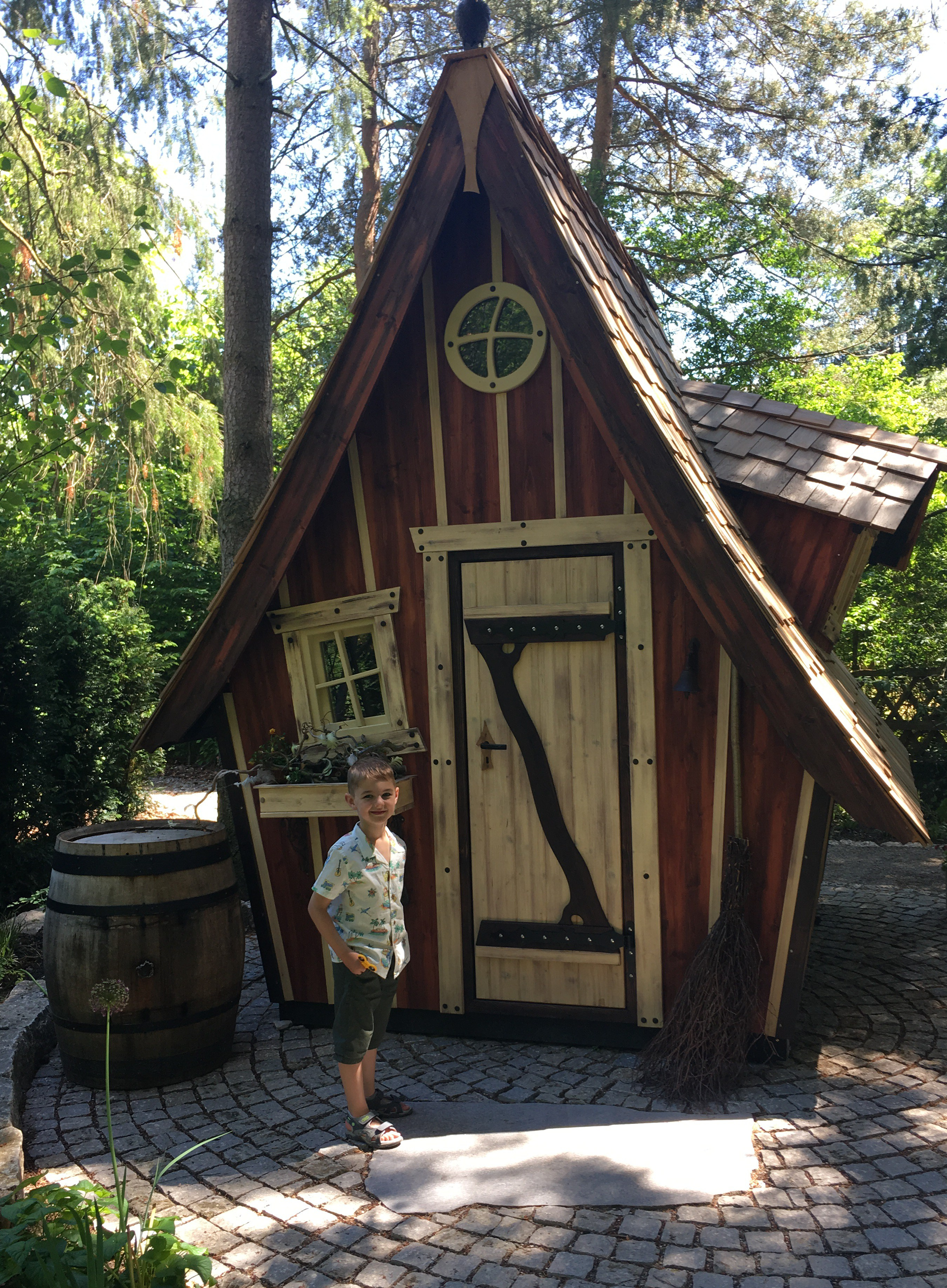 Things Helen Loves, small boy next to model of traditional German house.
